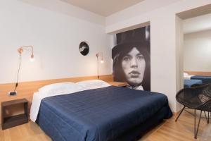 Postel nebo postele na pokoji v ubytování Garda Hotel