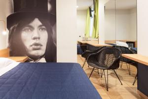 Postel nebo postele na pokoji v ubytování Garda Hotel