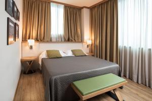 Postel nebo postele na pokoji v ubytování Garda Hotel