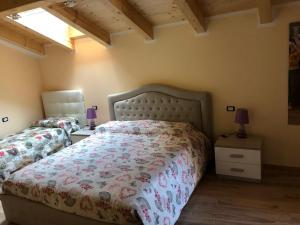 A bed or beds in a room at B&B Butterfly