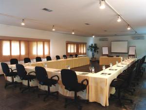 a large meeting room with a long table and chairs at Hotel Itapemar - Ilhabela in Ilhabela +37 photos