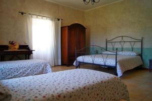 Ліжко або ліжка в номері Agriturismo Mammarella