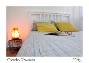 A bed or beds in a room at Cantinho D'Avenida