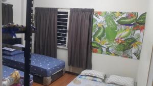 Postel nebo postele na pokoji v ubytování D'Hartamas Guesthouse