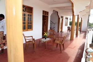 a dining room with a table and chairs at Nilaveli Star View Hotel in Nilaveli