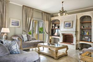 A seating area at Hidden Gem Estate - Superior luxury villa large private pool stunning sea & mountain views 5 acres of lush gardens World class accommodation