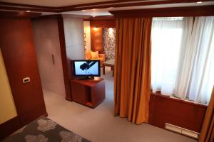 TV a/nebo společenská místnost v ubytování Garni Hotel Aleksandar