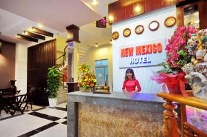 a woman standing at a new mexico hotel at New Mexico Hotel in Nha Trang