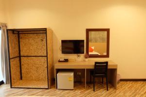 A television and/or entertainment centre at BK Place Hotel