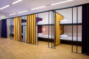 a group of bunk beds in a room at Hostel Tresor in Ljubljana