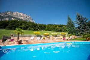 a swimming pool with a mountain in the background at Gasthof Wieser in Appiano sulla Strada del Vino +10 photos