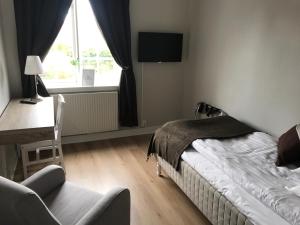 Postel nebo postele na pokoji v ubytování Hotell Humbla