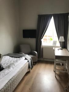 Postel nebo postele na pokoji v ubytování Hotell Humbla