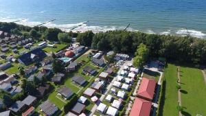 an aerial view of a small village by the water at Domki Letniskowe u Susła in Sianozety