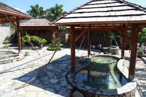 a pool with a gazebo and a swimming pool at The Mudan in Checheng