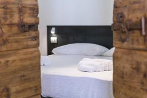 Cama ou camas em um quarto em Casa Kaki