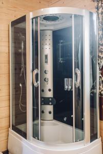 a mirror in a bathroom with a shower at Domik u morya in Gribovka +39 photos