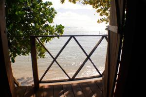 an open door to a view of the ocean at Chez Nath in Sainte Marie