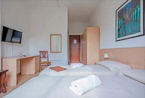 Postel nebo postele na pokoji v ubytování Albergo Rondò