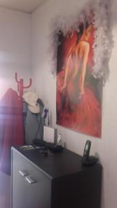 an office with a picture of a woman on the wall at "CHEZ AURELIE" T5 100m2 4ch 2sdb parking terrasse TALENCE in Talence