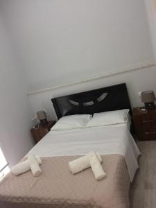 Postel nebo postele na pokoji v ubytování Kvara's House