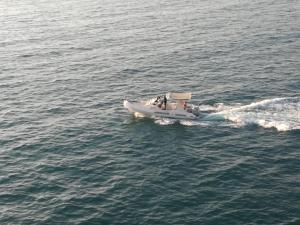 a small boat in a body of water at Villa Santa Maria in Vlorë