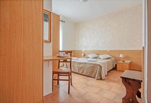 Postel nebo postele na pokoji v ubytování Albergo Rondò
