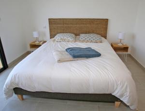 Кровать или кровати в номере Villa Vue Mer, piscine chauffée, tennis