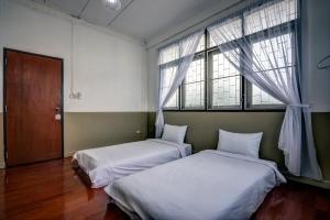 Postel nebo postele na pokoji v ubytování DoubleTree House