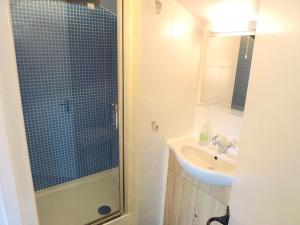 a bathroom with a sink and a shower at Manor Farm Stay in Sutton on Sea