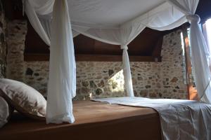 Postel nebo postele na pokoji v ubytování Ecoresort Sumba Dream
