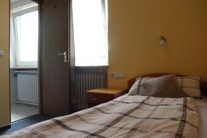 Postel nebo postele na pokoji v ubytování Hotel Zum Waldstein