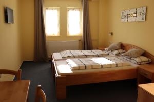 Postel nebo postele na pokoji v ubytování Hotel Zum Waldstein