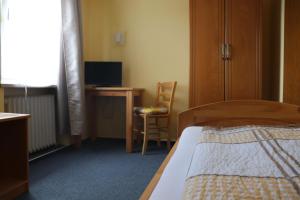 Postel nebo postele na pokoji v ubytování Hotel Zum Waldstein