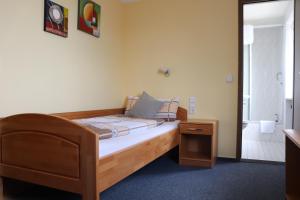 Postel nebo postele na pokoji v ubytování Hotel Zum Waldstein