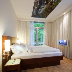 Katil atau katil-katil dalam bilik di Grand Hotel Mussmann