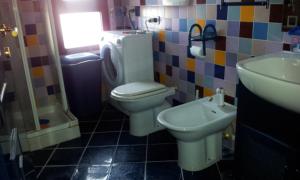 a bathroom with a toilet and a sink at Sole e Luna in Gaeta