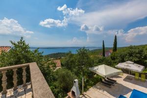 a villa with a view of the ocean at Apartments Slavica in Dramalj