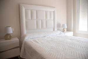 Posteľ alebo postele v izbe v ubytovaní Apartamento BellaVista