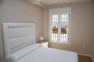 Posteľ alebo postele v izbe v ubytovaní Apartamento BellaVista