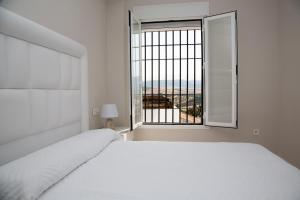 Posteľ alebo postele v izbe v ubytovaní Apartamento BellaVista