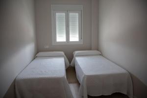 Posteľ alebo postele v izbe v ubytovaní Apartamento BellaVista