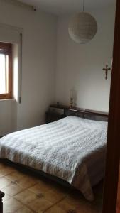 Een bed of bedden in een kamer bij casa Nonna Nina