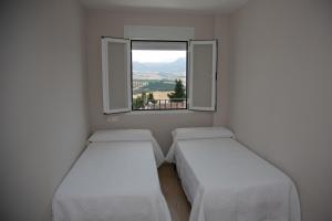 Posteľ alebo postele v izbe v ubytovaní Apartamento BellaVista