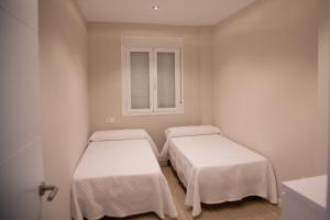 Posteľ alebo postele v izbe v ubytovaní Apartamento BellaVista