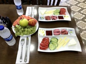 a table with three trays of food on it at Fatih Babel Park Hotel in Istanbul
