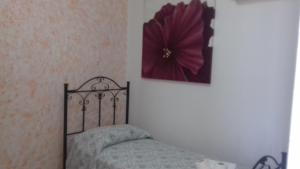 Кровать или кровати в номере Albergo San Rocco