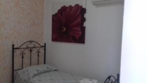 Кровать или кровати в номере Albergo San Rocco