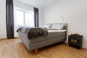 Tempat tidur dalam kamar di Ferienwohnungen Unterleegut