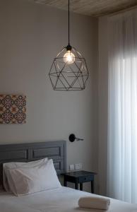 Voodi või voodid majutusasutuse Chapter 5 Hotel toas